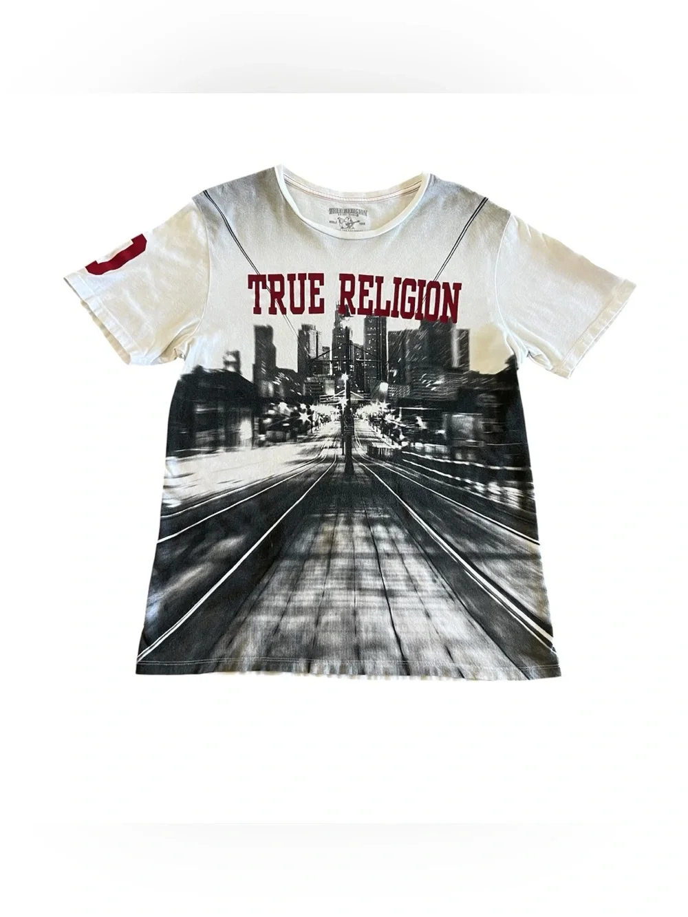 True Religion World Tour Men’s Relaxed Bench Tee city scene graphic
